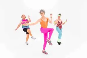 Older people dancing happily to maintain health and learn how to make bones stronger